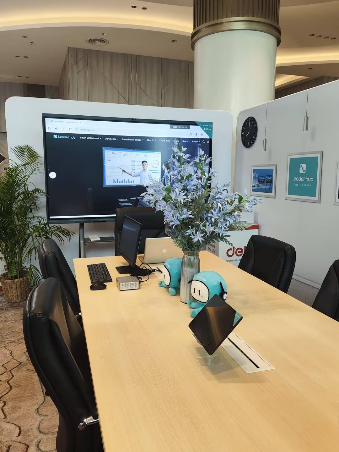 Team collaborating on a smart board in a meeting room