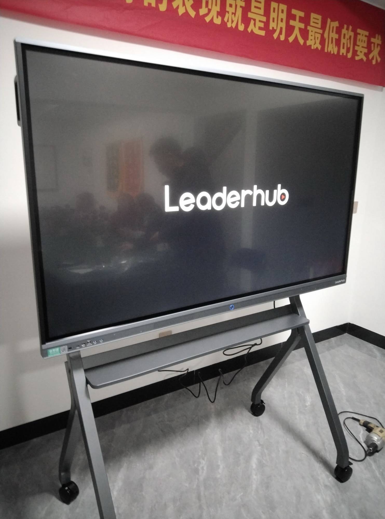 Teacher using interactive whiteboard for collaborative lesson with students