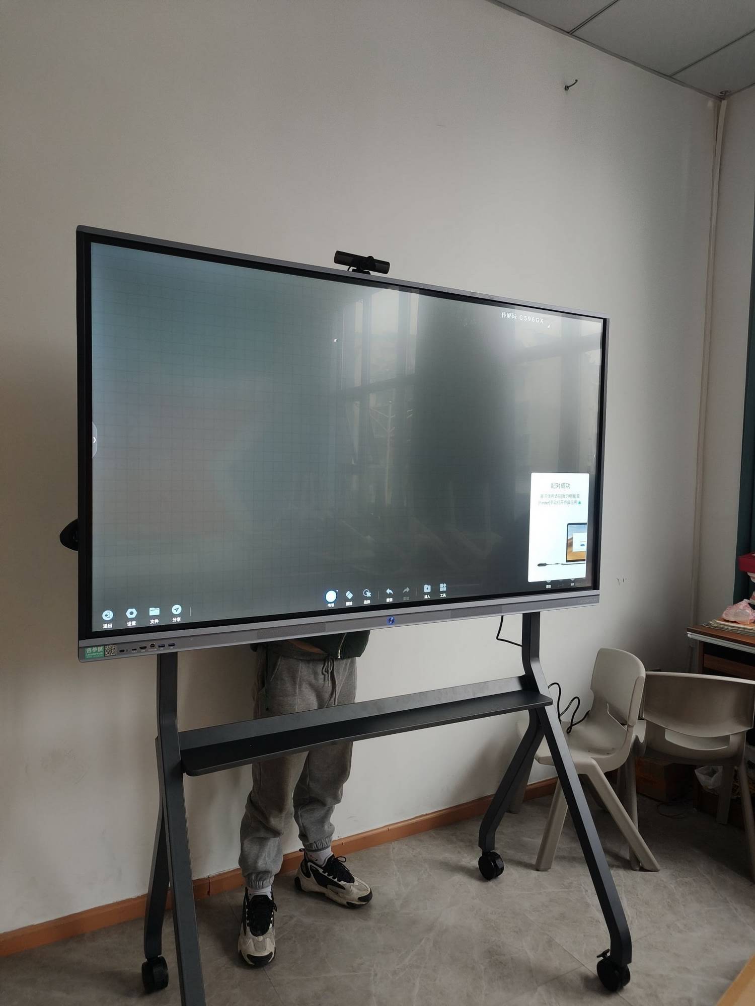 Digital stylus being used on interactive smart board display