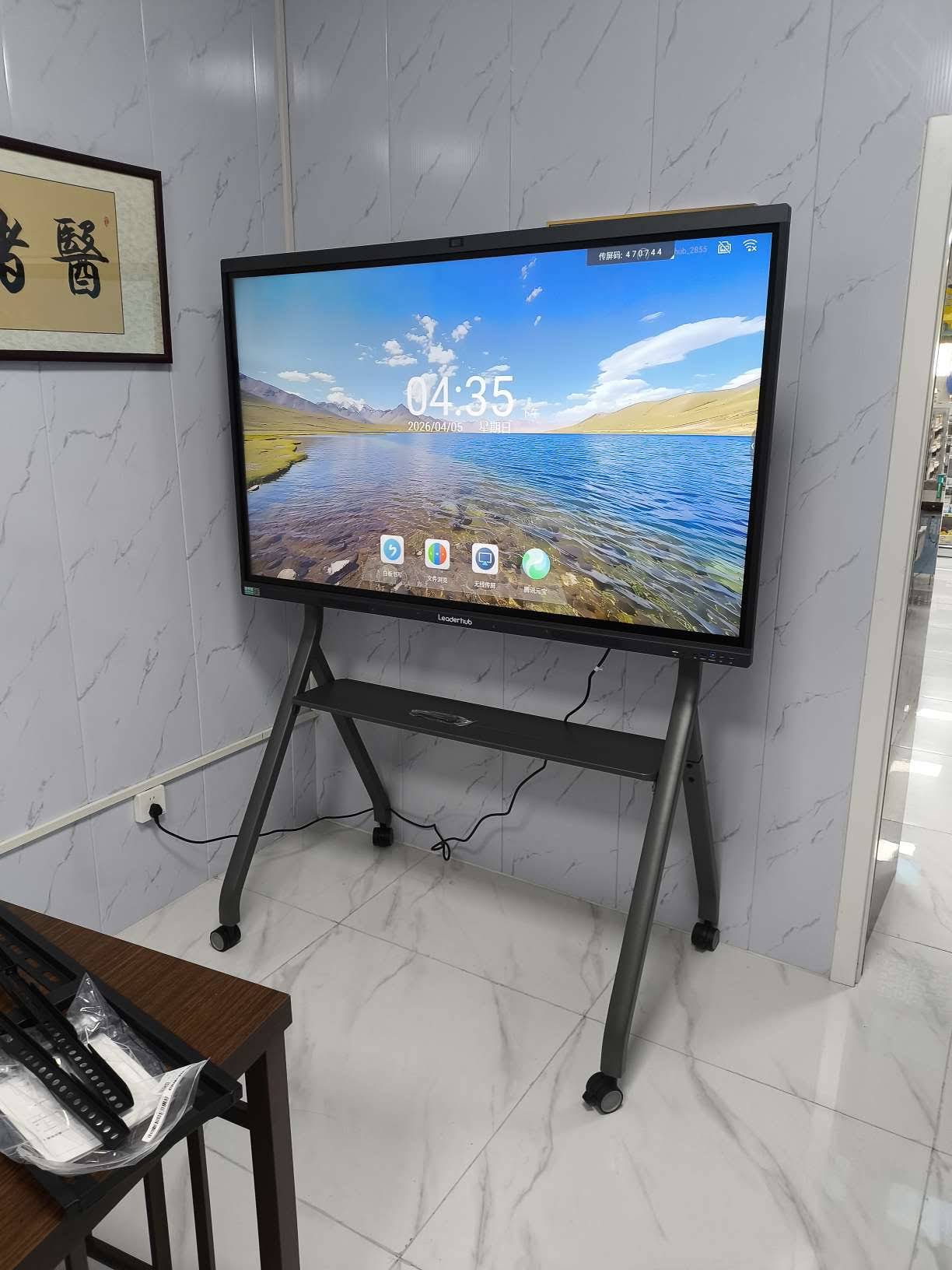 Wall-mounted smart whiteboard installed in a modern meeting room