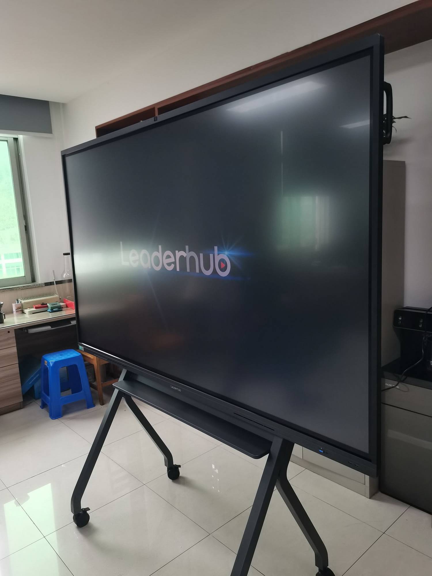 Professional displaying content on smart board connected to laptop