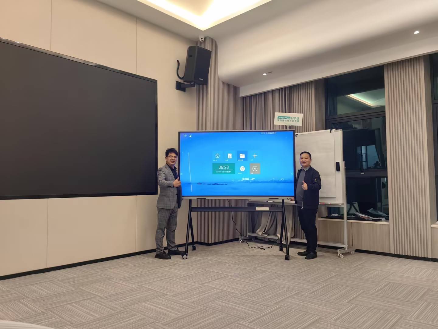 Business professionals collaborating using smart board in conference room