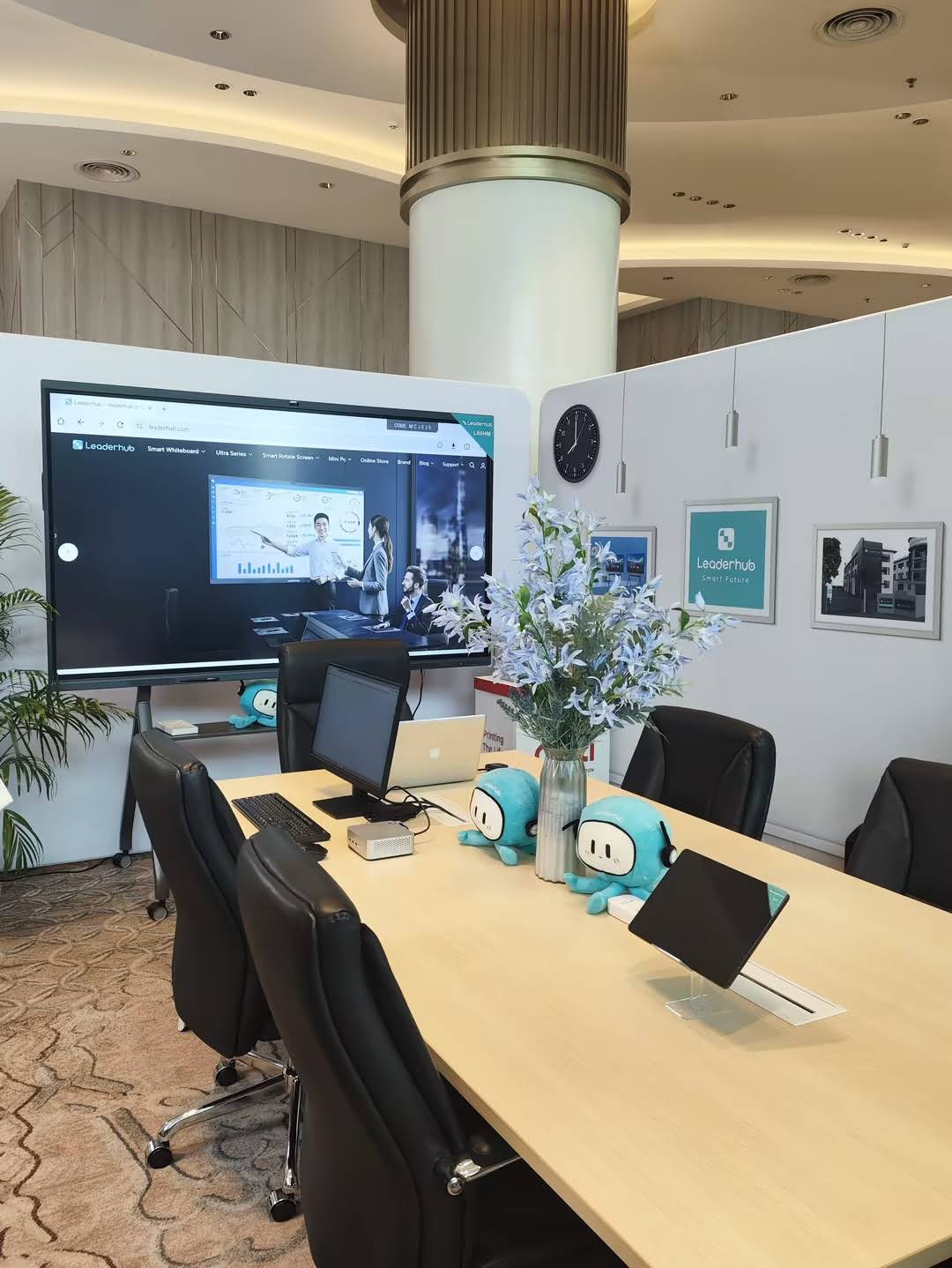 Conference room setup with interactive smart board and touch control panel