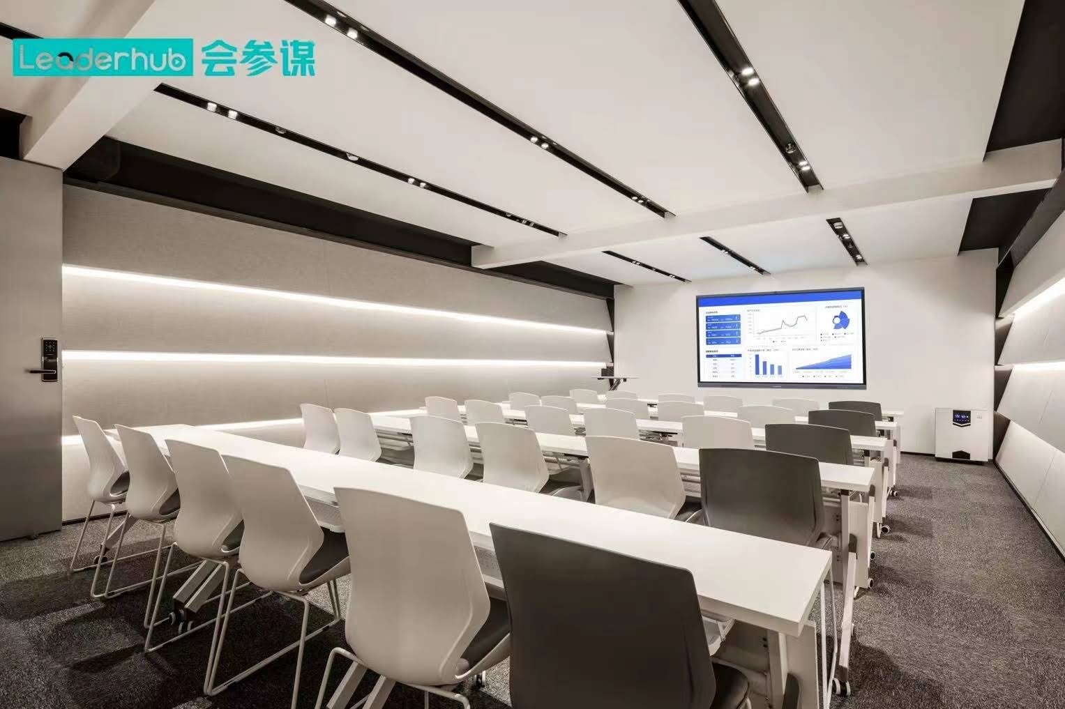 Teacher using smart board without shadow interference in classroom