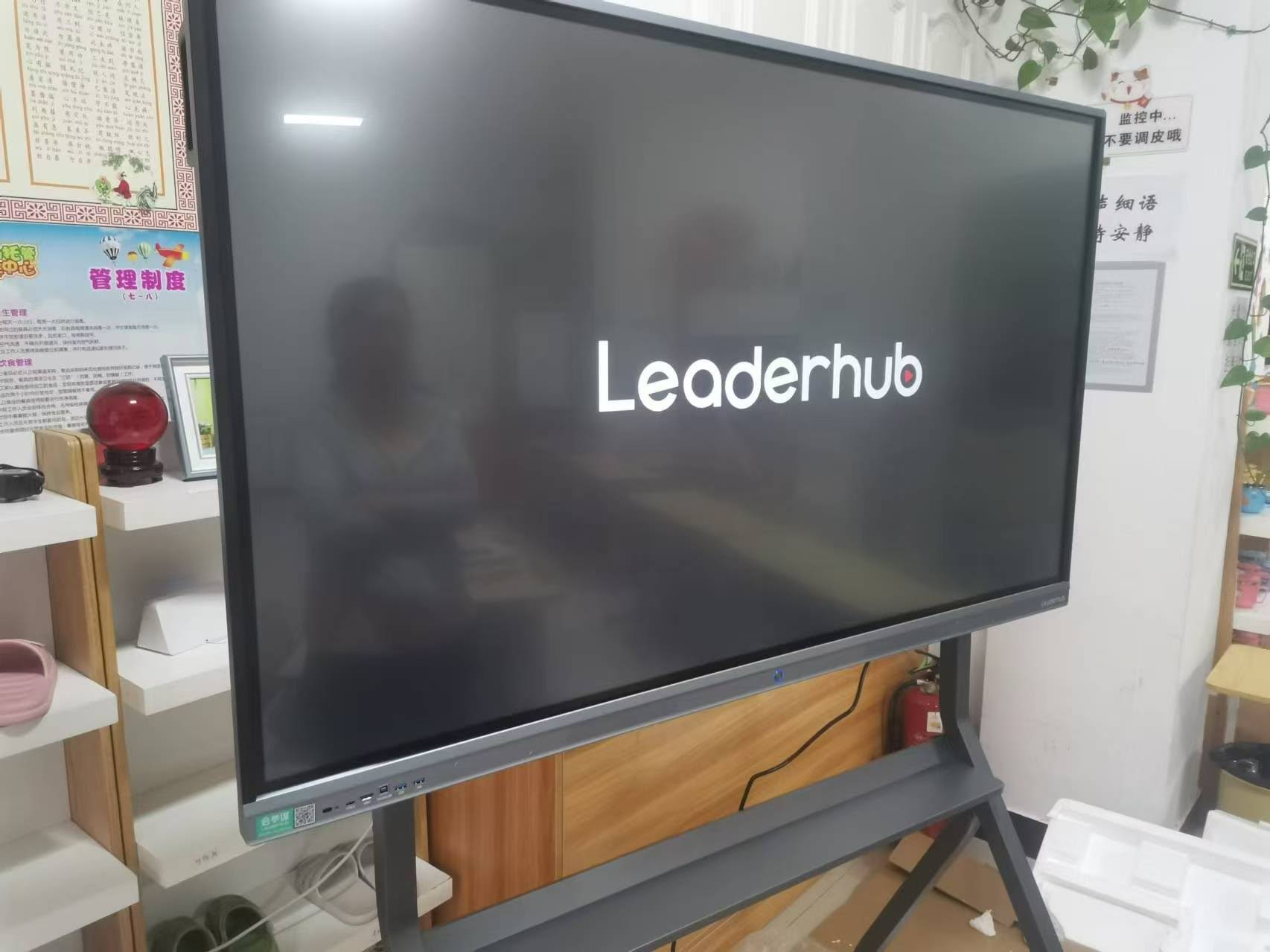 Team collaborating using an interactive whiteboard in a corporate meeting