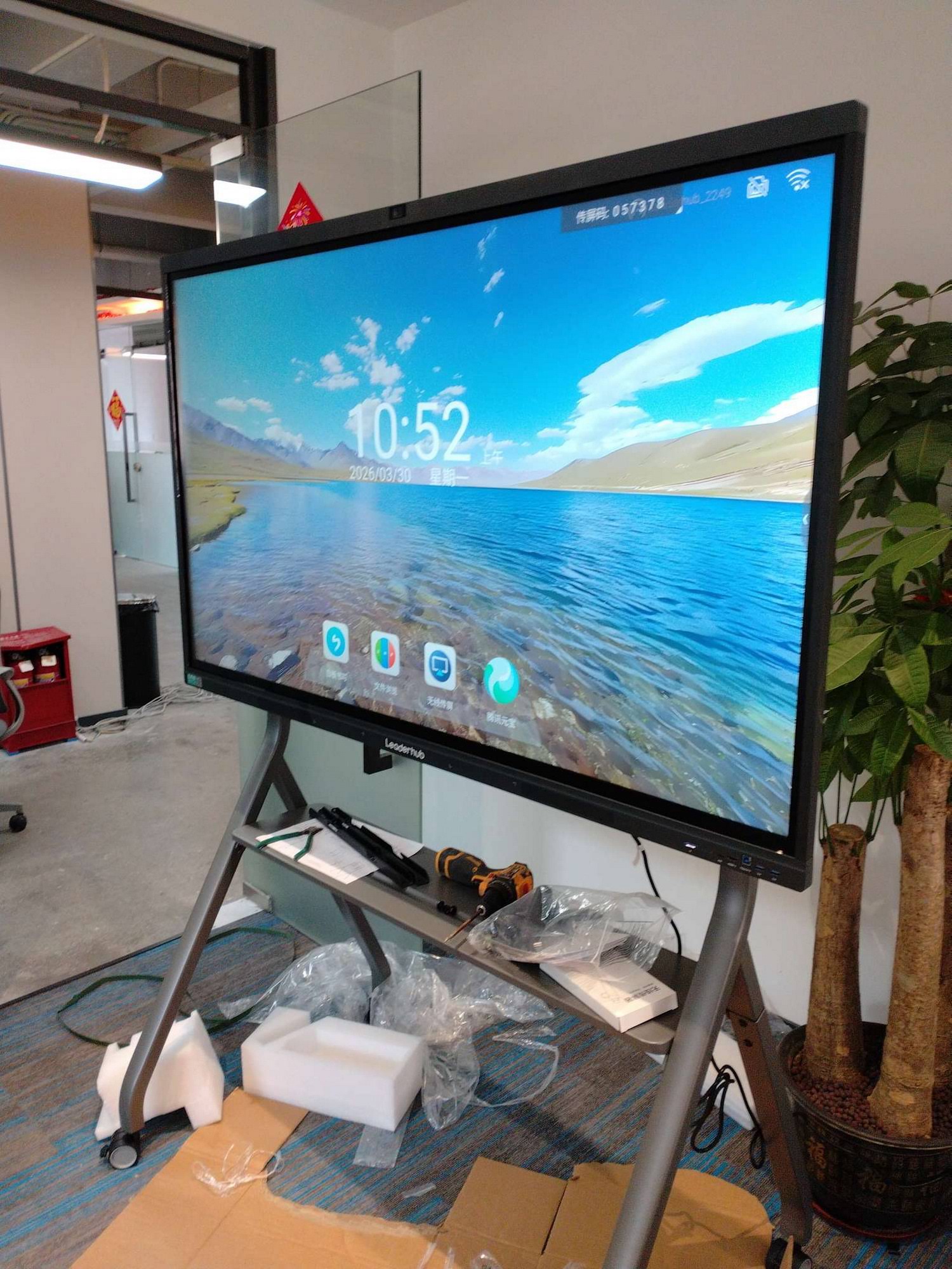 IT staff installing a smart whiteboard in a university lecture hall