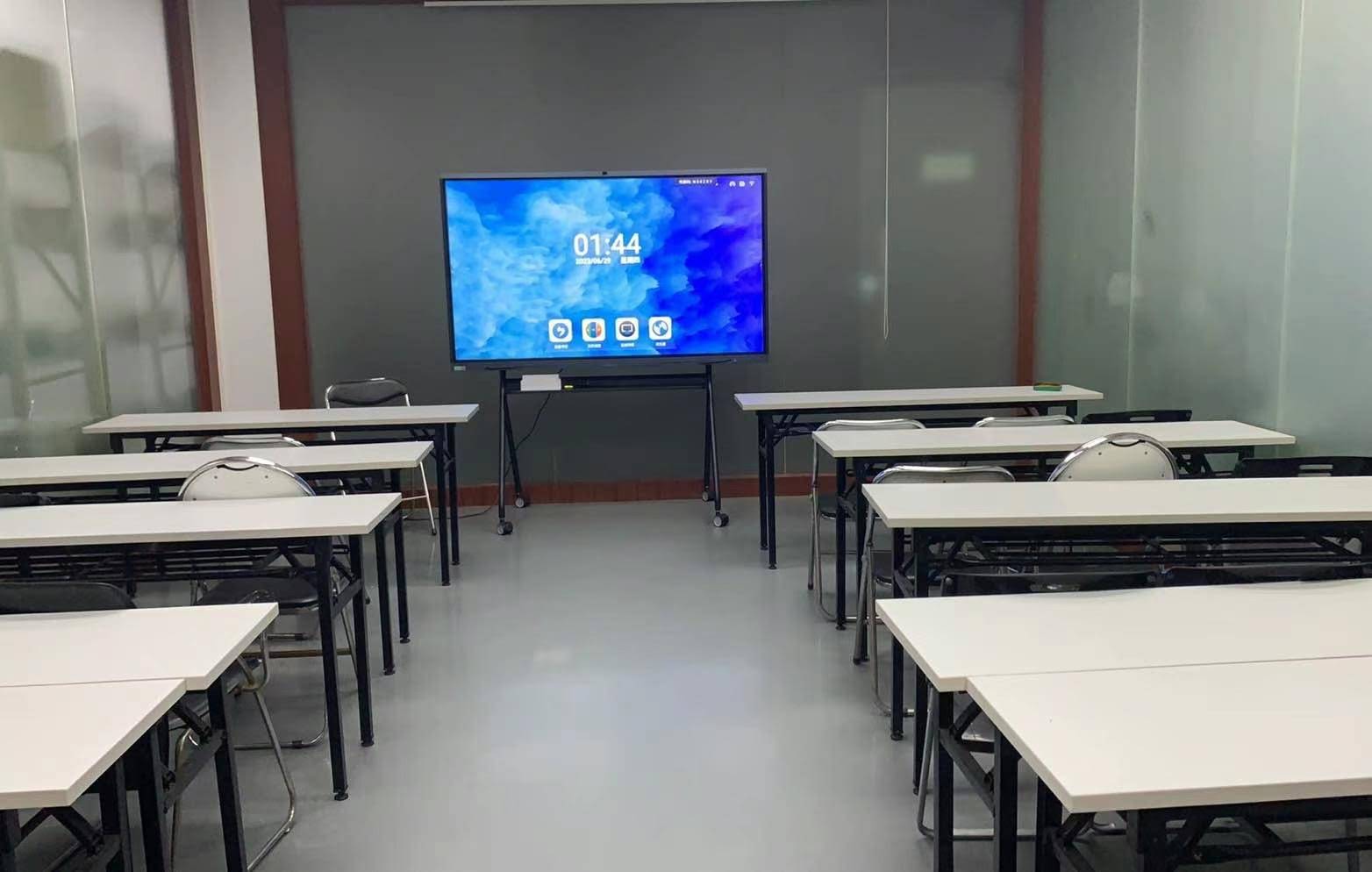 Teacher using a smart board pen on an interactive whiteboard