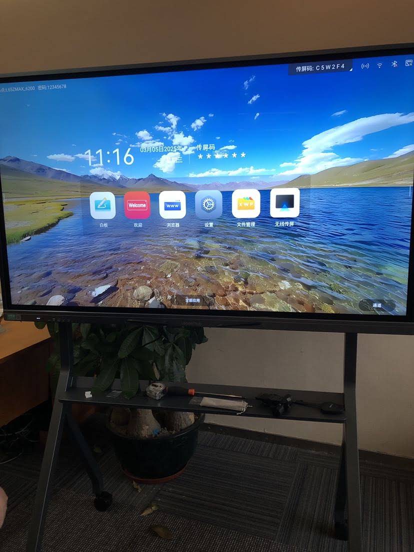 Teacher using an 86-inch smart whiteboard in a classroom setting