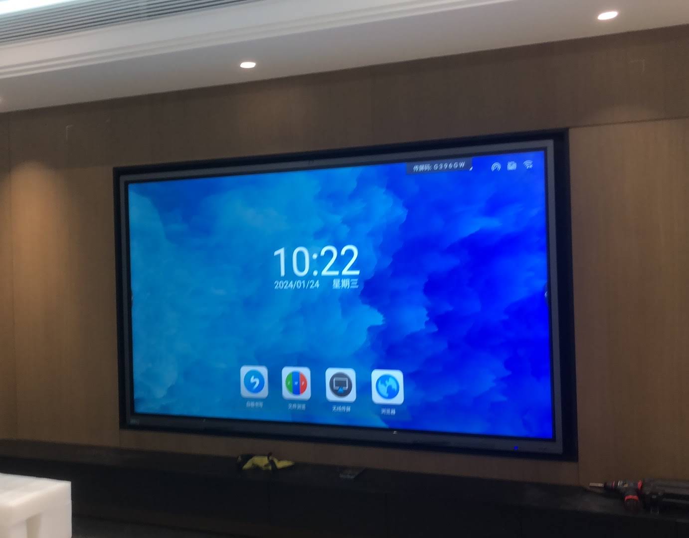 Business professional demonstrating screen freeze on interactive panel during meeting
