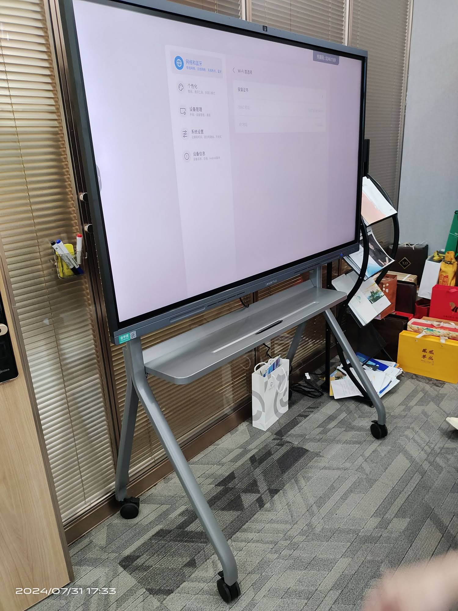 Professional educator calibrating interactive smart board in modern classroom