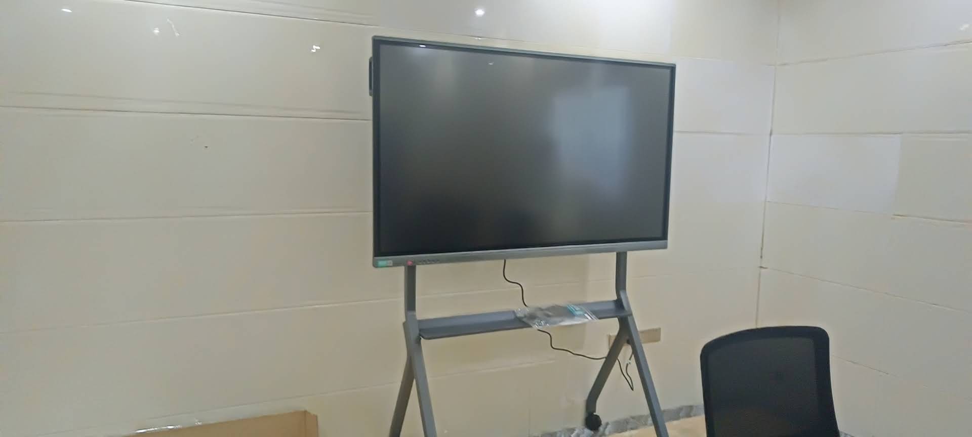 Close-up view of touch interaction on smart whiteboard screen