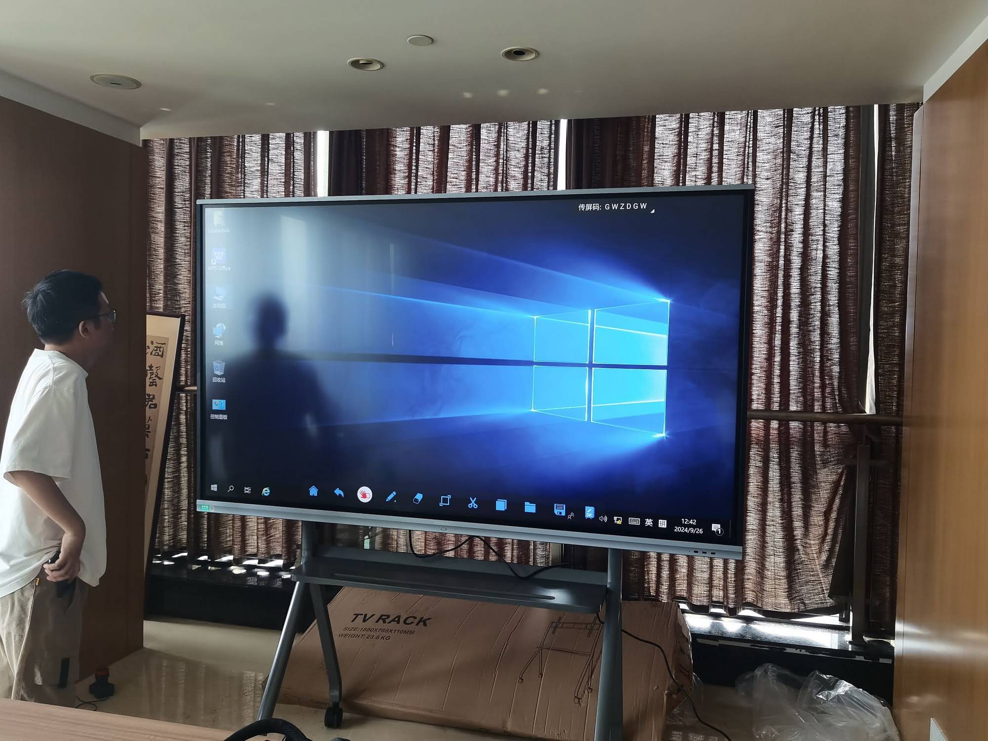 Students interacting with a smart board in a classroom setting