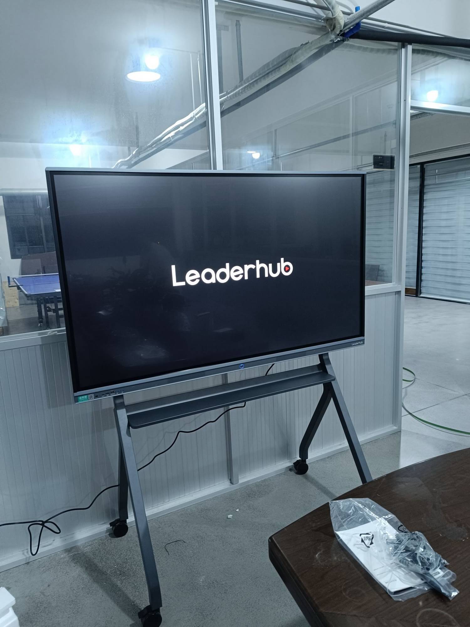 Teacher using 75-inch interactive smart board for mathematics lesson