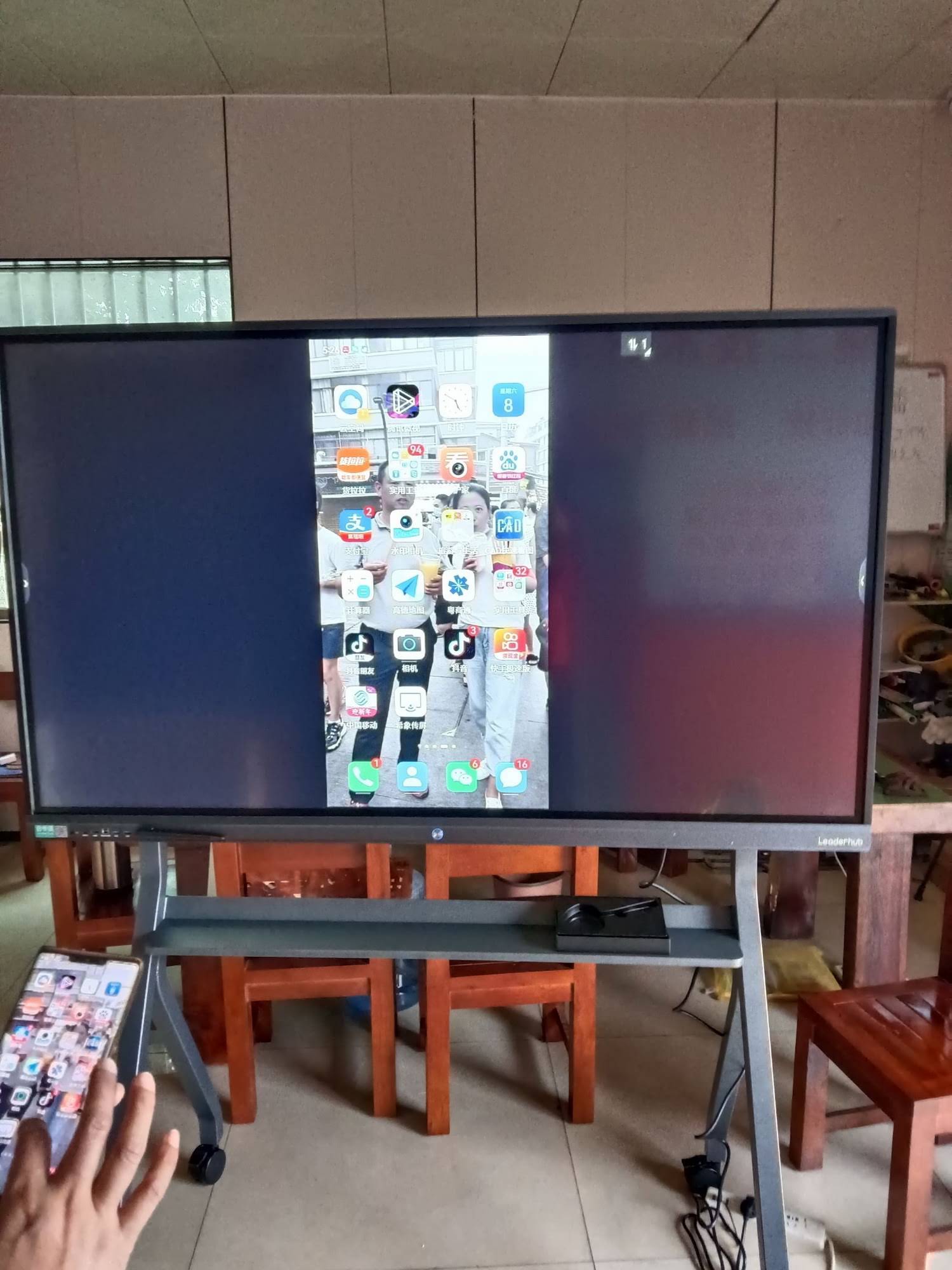 Modern smart whiteboard in classroom setting
