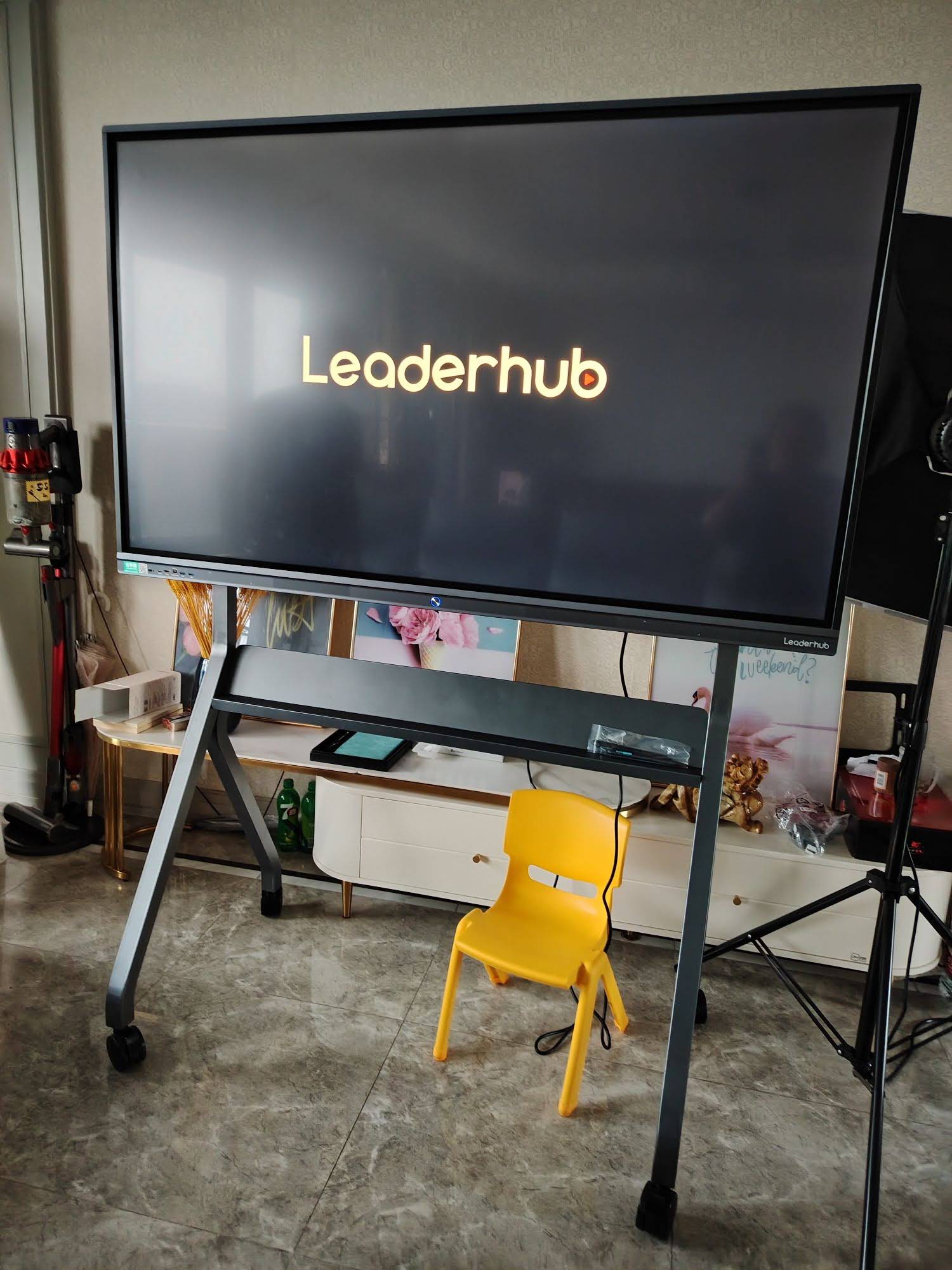 Students engaging with a large interactive smart display