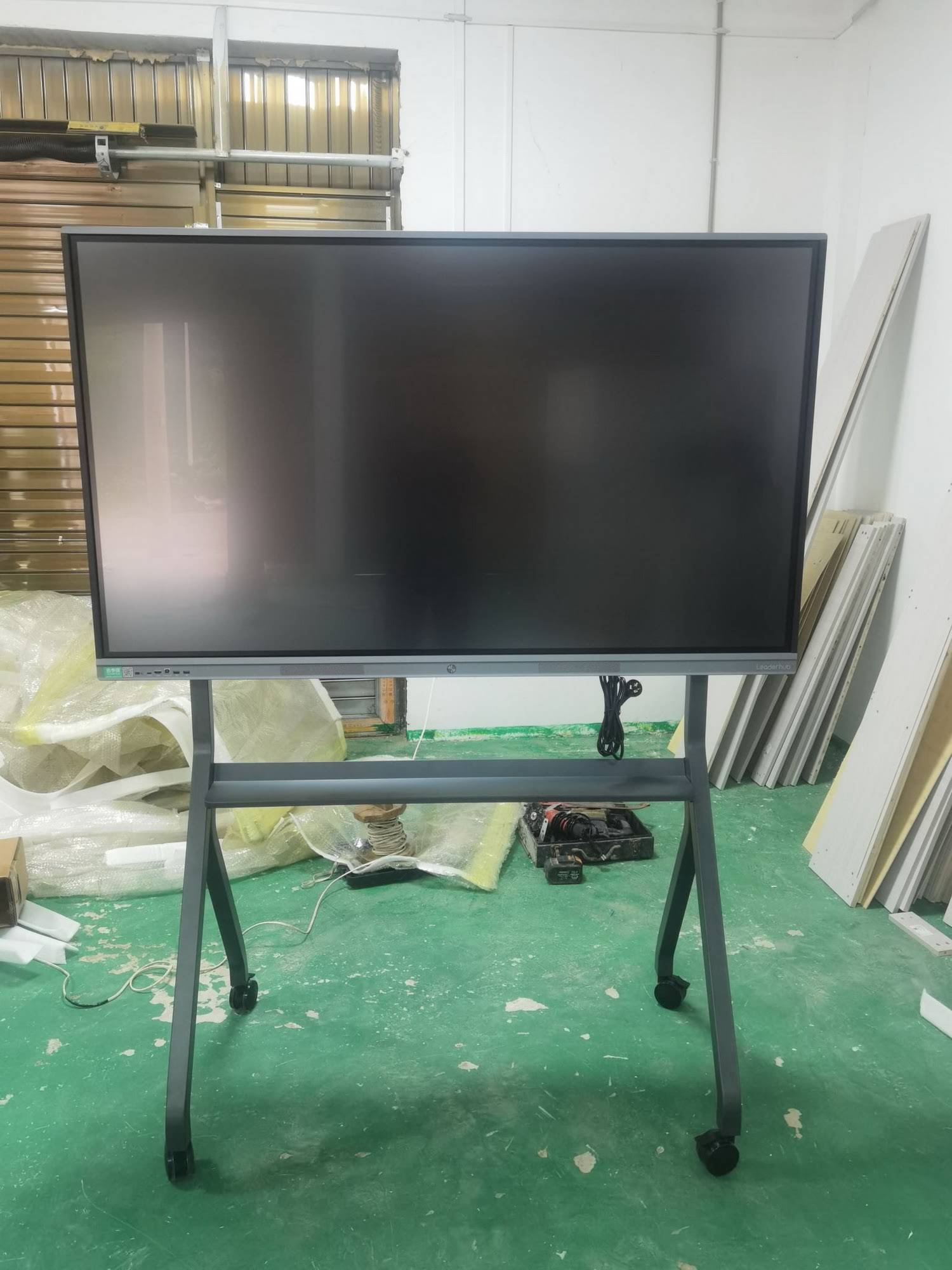 Adjustable height smart whiteboard in classroom setting
