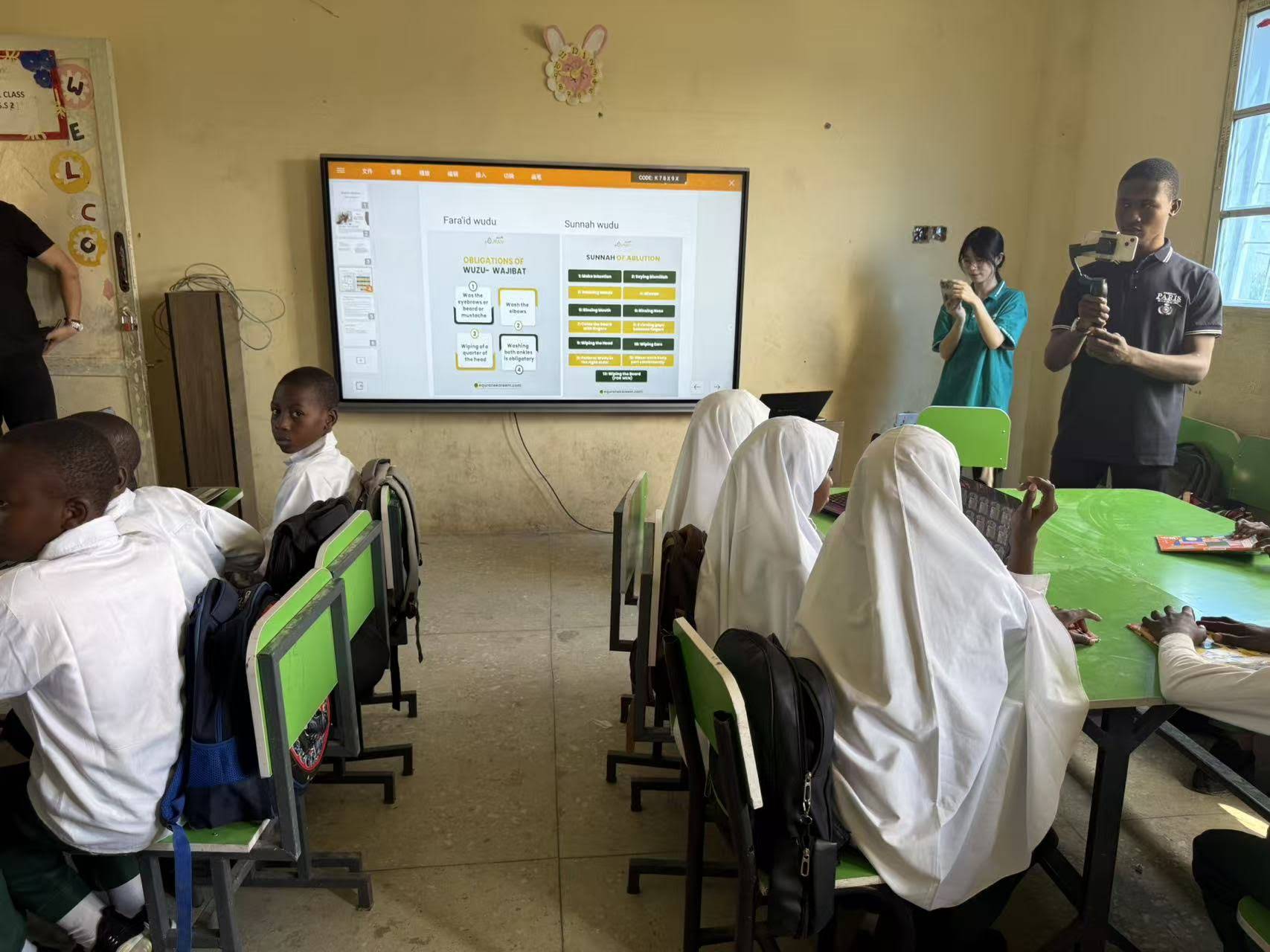 Teacher using smart board for interactive lesson