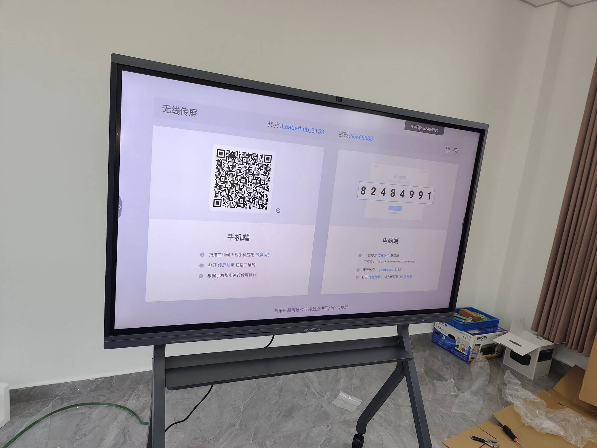 Teacher writing on an interactive flat panel during a lesson