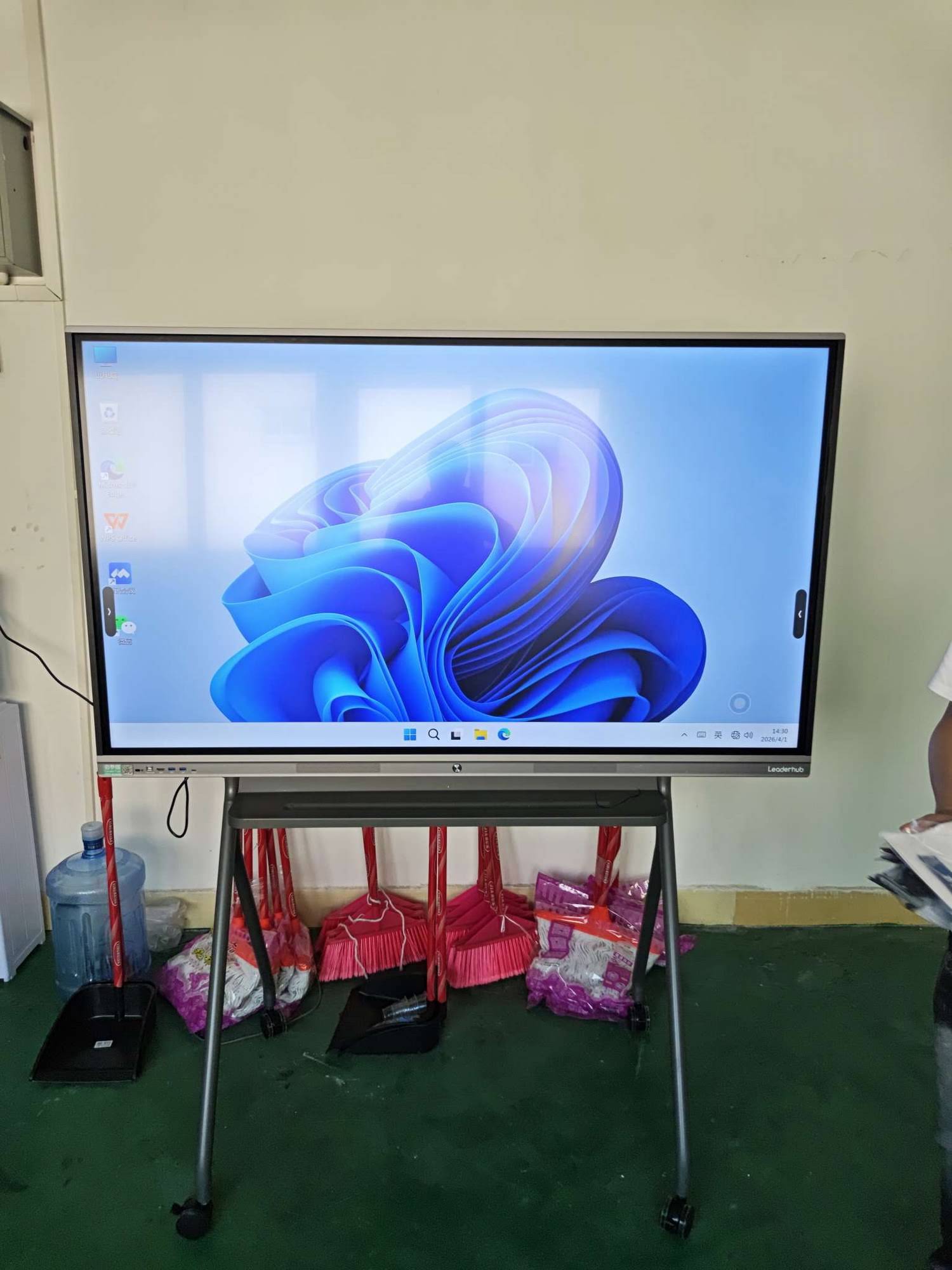Team collaborating around a smart whiteboard during a group training session