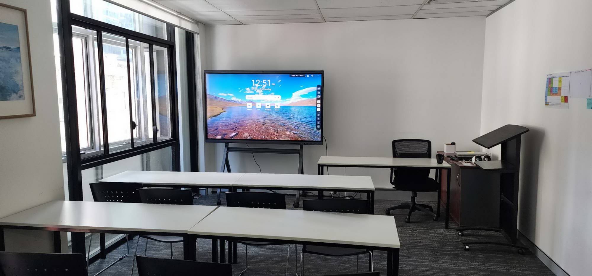 Educators using an interactive smart board for collaborative learning activities